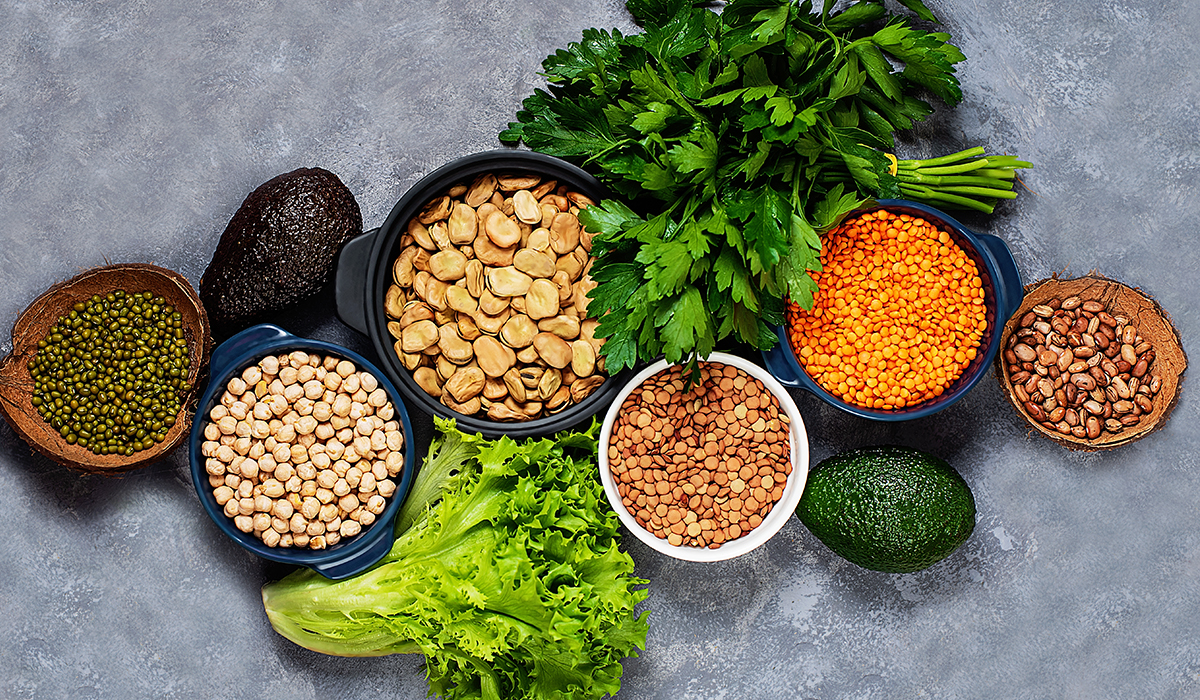 Multiple types of major grains laid out on the table in different bowls