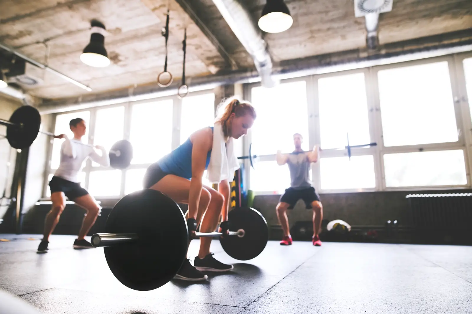 Women in a gym using freeweights